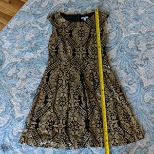 EVA MENDES BLACK AND GOLD DRESS